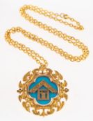 A 9ct gold Masonic pendant, ornately designed with Masonic emblems on a blue background,
