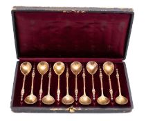 A cased set of twelve French silver Renaissance revival silver-gilt coffee spoons, .