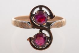 A two stone ruby ring, set with two circular-cut rubies, rubies approx. 0.