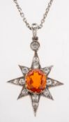 A fine fire opal and diamond pendant with chain, a star-shaped pendant,