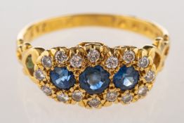 An 18ct gold sapphire and diamond ring,