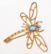 A dragonfly brooch, a bi-colour openwork brooch in the form of a dragonfly,