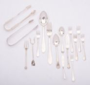 A mixed group of silver; including two pairs of sugar tongs, two tea spoons, two butter knives,
