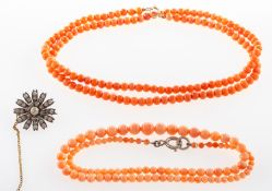 A mixed group of jewellery, including a Victorian flower brooch set with paste stones, safety chain,