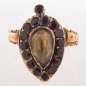 A Victorian memorial ring, set to the centre with a pear-shaped citrine,