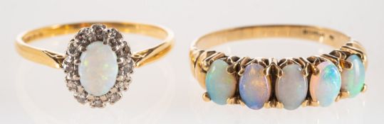 A group of two opal rings,
