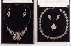 A group of two vintage cased suites of jewellery, including a maple leaf & marcasite set necklace,