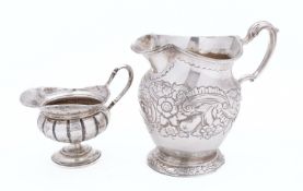 A George III silver milk jug by Joseph Craddock & William Ker Reid, London 1817, of baluster form,