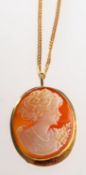 A cameo brooch pendant with chain, an oval cameo brooch with pendant fitting, marked 750,