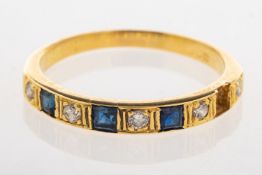 A sapphire and diamond eternity ring,