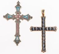 A group of two cross pendants,