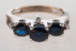 A late 1970's sapphire and diamond ring,