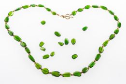 A chrome diopside necklace, the green chrome diopside beads of organic form,