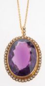 A impressive Victorian amethyst & seed pearl pendant, set with an oval mixed-cut amethyst, approx.