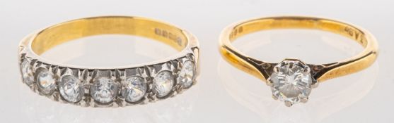 A group of two 18ct gold rings, including a solitaire ring set with a brilliant-cut diamond,