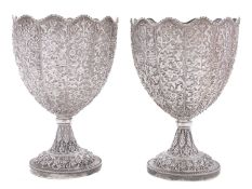 A pair of late 19th century Indian Kutch silver standing cups or goblets marked W&O,