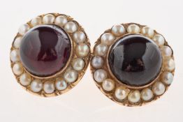 A pair of garnet and pearl earrings, of circular form,