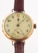 A vintage 9ct gold wristwatch the dial with black and red Arabic numerals,