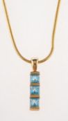 A blue topaz pendant and snake chain, a line pendant set with three table-cut blue topaz,