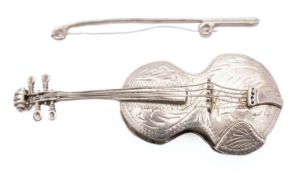 An America novelty silver violin and bow pill case by R.