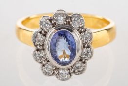 An 18ct gold tanzanite and diamond ring,
