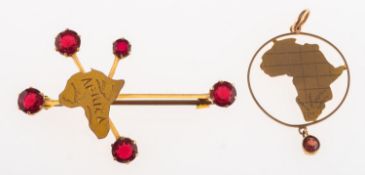 A group of two items of jewellery both depicting the map of Africa,