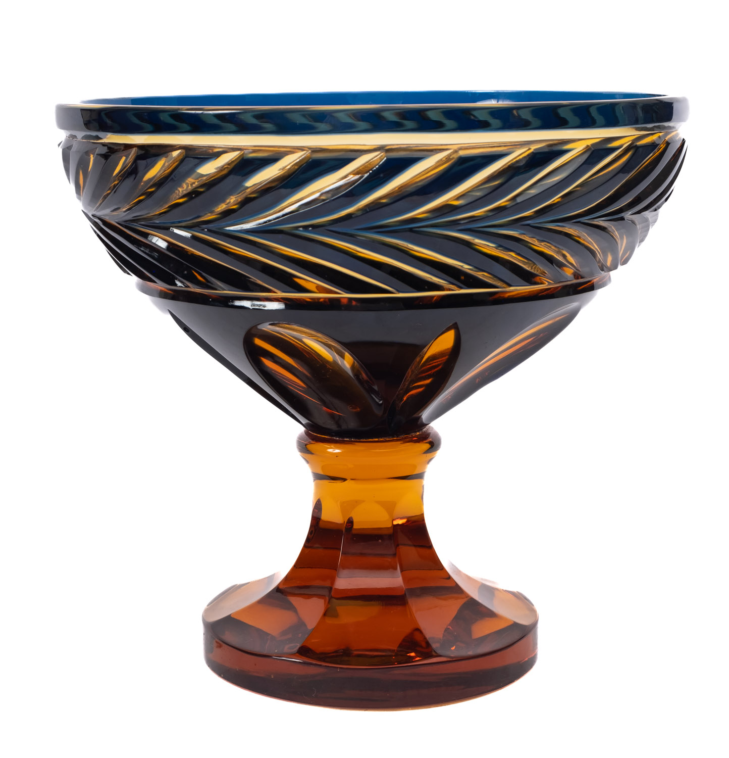 An amber and blue flashed pedestal bowl with cut decoration, 25cm diameter.