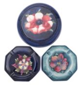 Three pieces of Walter Moorcroft pottery comprising a stand tube lined in the Anemone pattern on