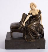 WITHDRAWN A Continental bronze and ivory mounted model of a maiden, in Art Deco style,
