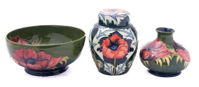 A Moorcroft pottery jar and cover tube lined in the Poppies pattern,