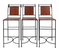 A set of three wrought iron and leather bar chairs,