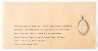 Eric Gill ARA (1882-1940), an engraved metal pendant; of navette form,