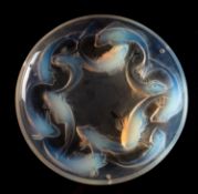 A Lalique shallow bowl Matigues the opalescent body moulded to the underside with twelve swirling