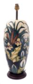 A Moorcroft pottery lamp base, tube lined in the Lamia pattern, after the original by Rachel Bishop,