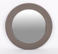 A grey painted fibreboard framed circular wall mirror, modern; with broad,
