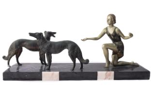 A painted metal and marble mounted figural group in Art Deco style,