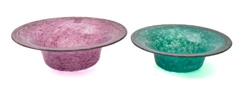 Two Monart glass bowls of flaring circular form one of mottled swirling purple colour with