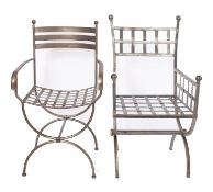 Two similar wrought metal elbow chairs, modern; with open lattice worked backrests and seats,