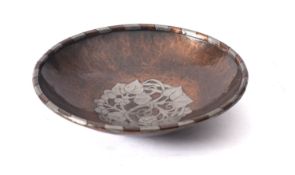 A copper and white metal inset bowl in Arts & Crafts style,
