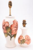 Two Moorcroft pottery lamp bases, tube lined in the Coral Hibiscus pattern, impressed marks,