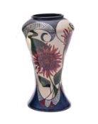A Moorcroft Black Ryden pottery vase of waisted form painted with panels of deep red chrysanthemum,
