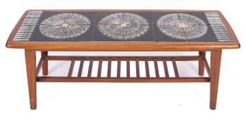 A teak and tile topped coffee table, retailed by Heals,