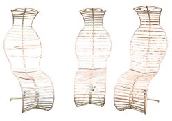 A set of three painted wrought iron 'cobra' garden chairs, in the manner of André Dubreuil,