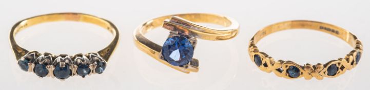 A group of three rings, to include a cro