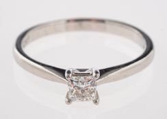 A platinum and diamond ring, set with a