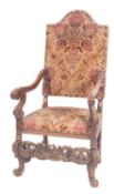 A carved walnut and Damask velvet uphols