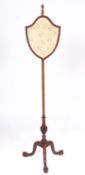 A mahogany and silkwork pole screen in G
