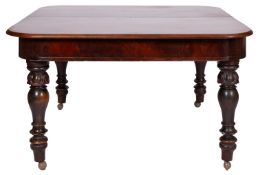 A Victorian mahogany extending dining ta