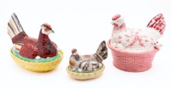 Three pottery dishes and covers, in the