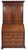 A George III oak and line inlaid bureau
